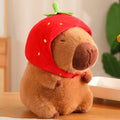 Adorable Capybara Plushie Adorned with a Cute Strawberry Hat